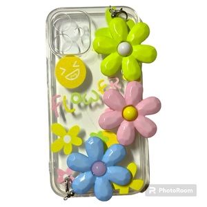 iPhone 12 mini cell phone case with Pink, Blue, Green and Yellow Flowers.